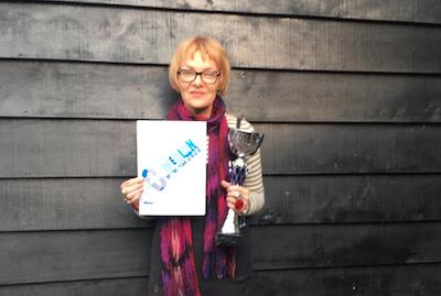 Sallyann Fellows, winner of the New Forest New Comedian of the Year competition, holds her winners trophy