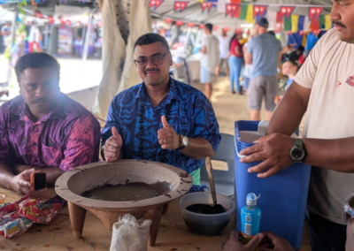 Image of a man standing over a bowl with his thumbs up