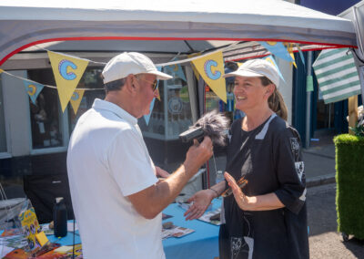 A woman is being interviewed by a man